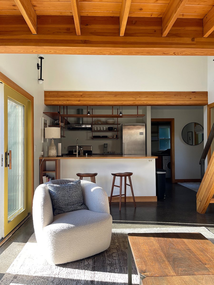 View in living room to kitchen, laundry room beyond. 