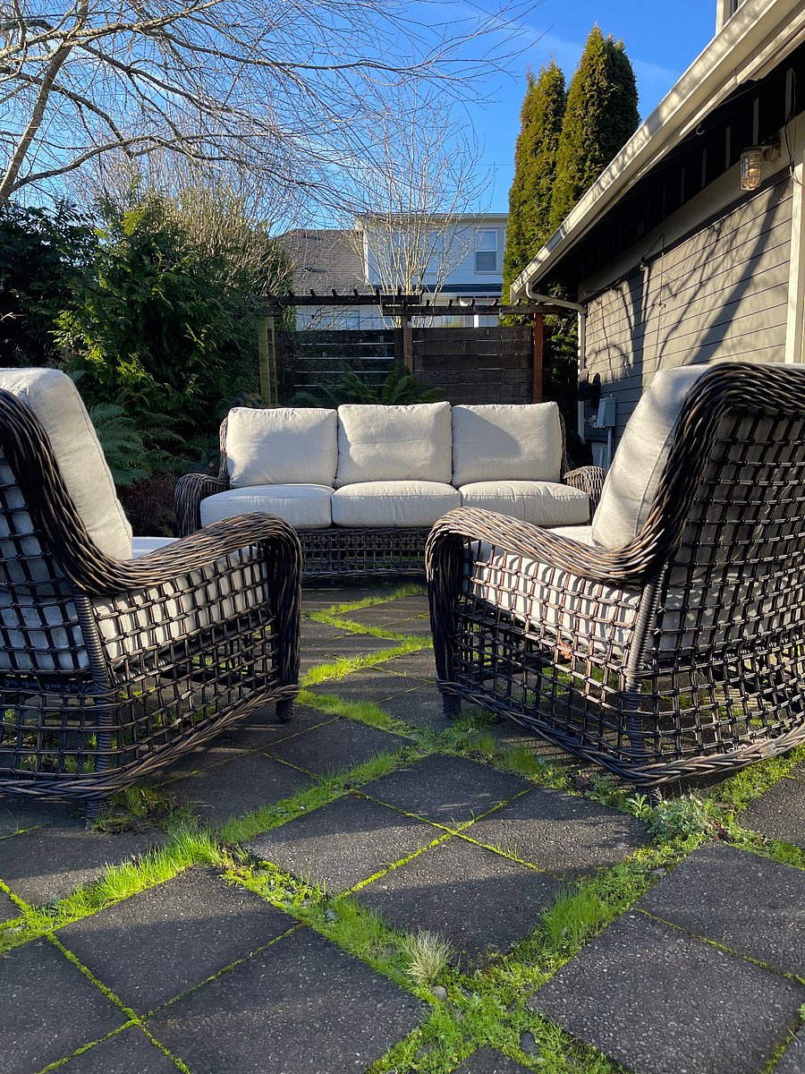 Enclosed back patio with comfortable seating group.