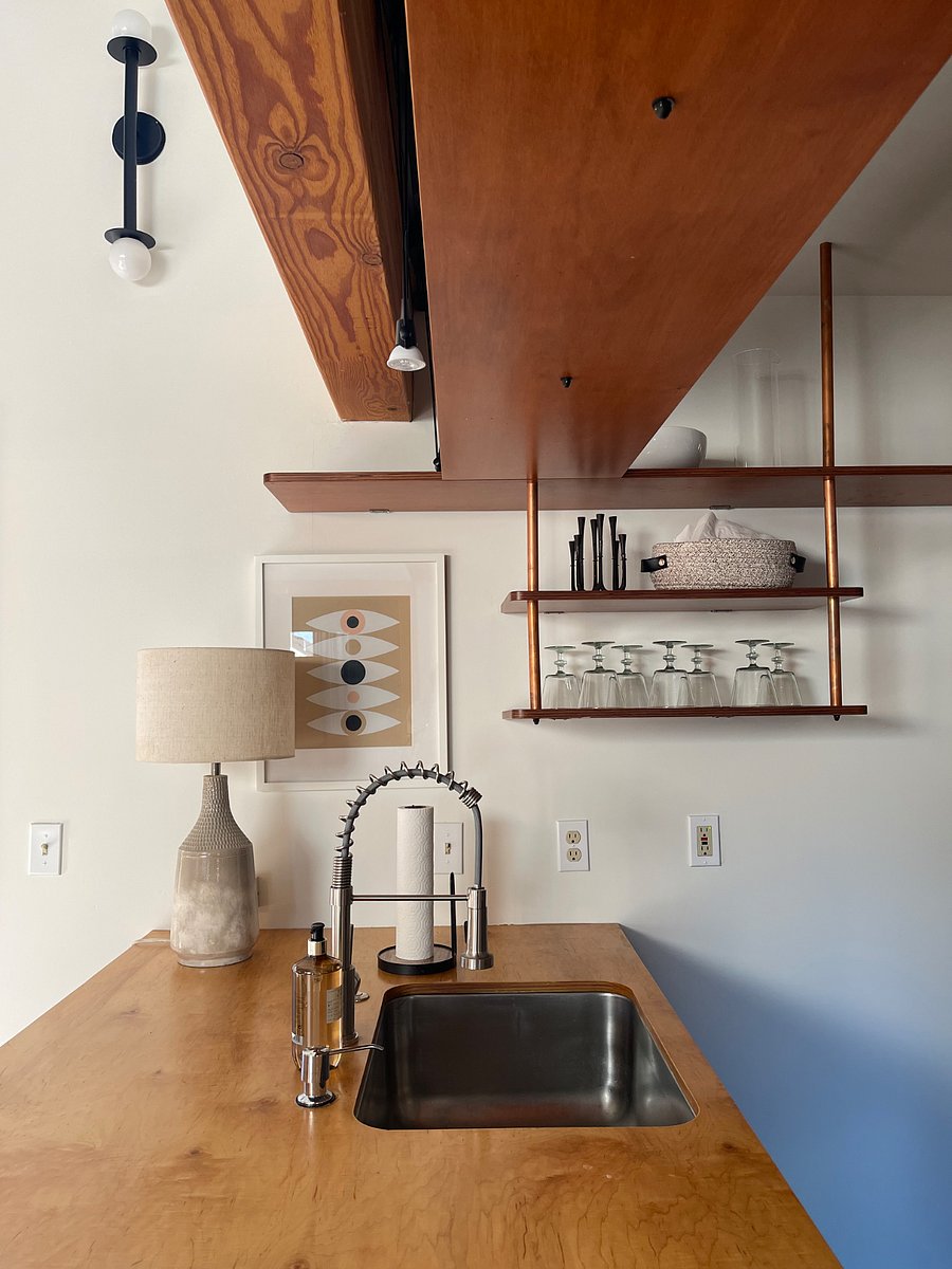 Kitchen - modern, mid-century feel with open upper storage shelving. 