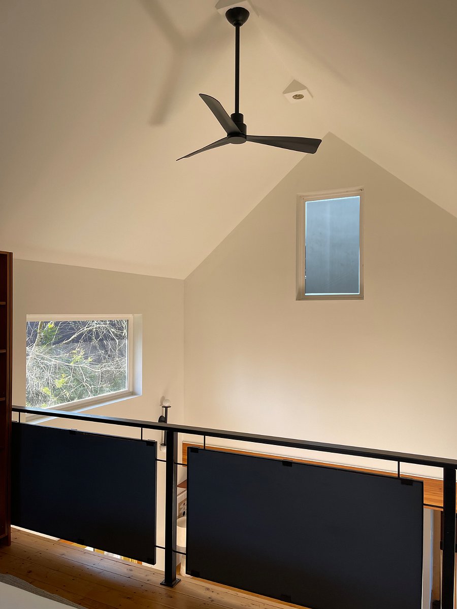 View from bed in loft, ceiling fan to service entire space.