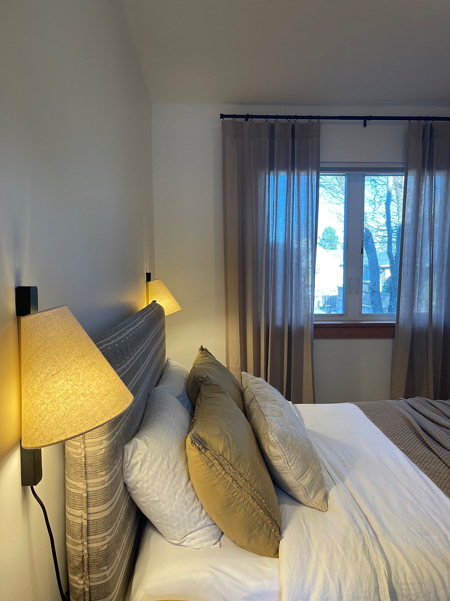 Queen bedroom - light filtering drapery panels for daytime privacy and blackout shade for sleeping. 