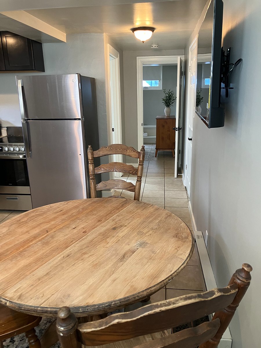 Large antigue table that serves as a gathering space and home office. Connect with the smart TV for an extra screen.