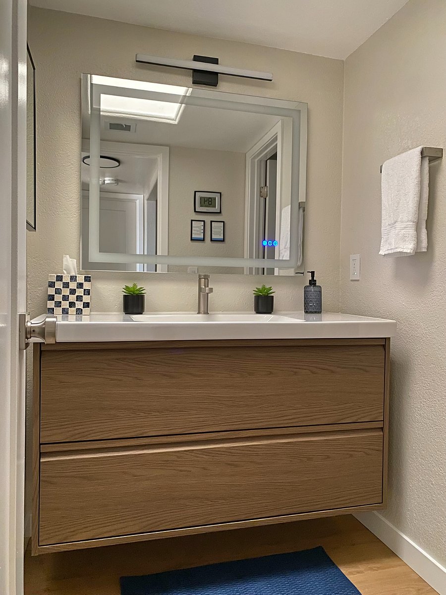 From brushing your teeth to washing your face, the sleek floating vanity and backlit mirror make getting ready feel like a boutique hotel experience.