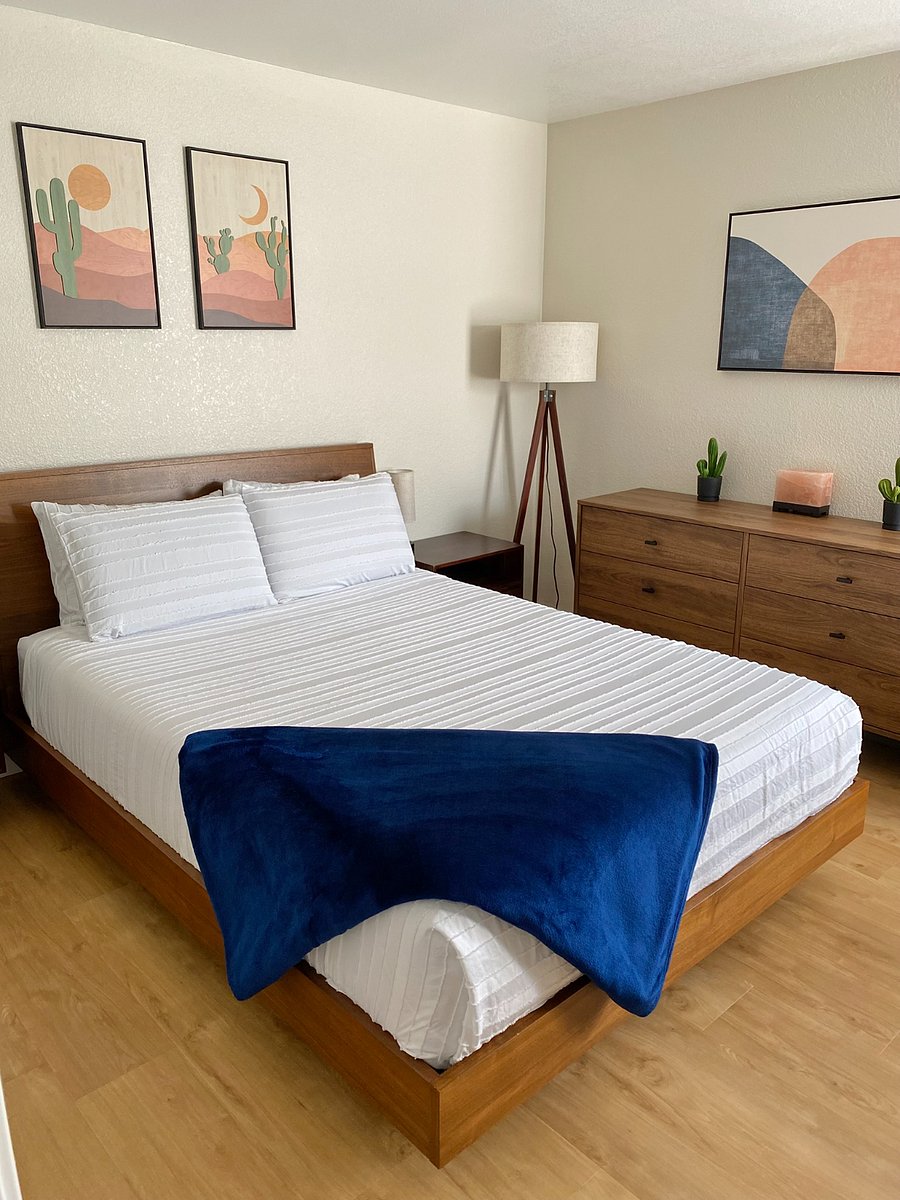 Sleep soundly in this mid-century modern bedroom, where the top-floor location and attentive touches create a quieter, more comfortable sleeping environment intended to help you rest at any time of the day.