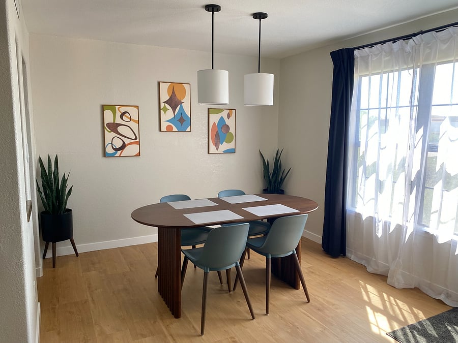 Enjoy home-cooked meals, takeout from La Encantada, or a memorable game night in this stylish mid-century modern dining room.