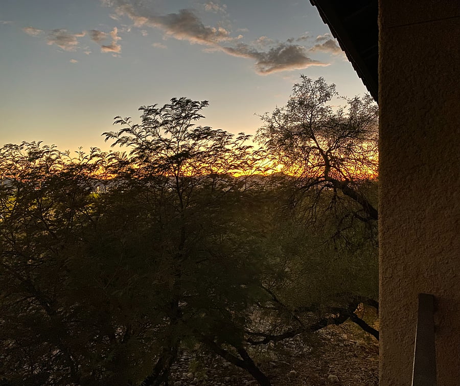 Sunsets play out colorfully on the balcony, starring desert trees and mountain silhouettes.
