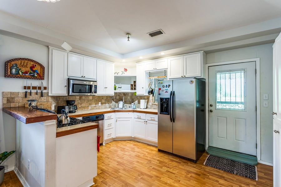 Kitchen with full size fridge, and all of the utensils and appliances you'll need.