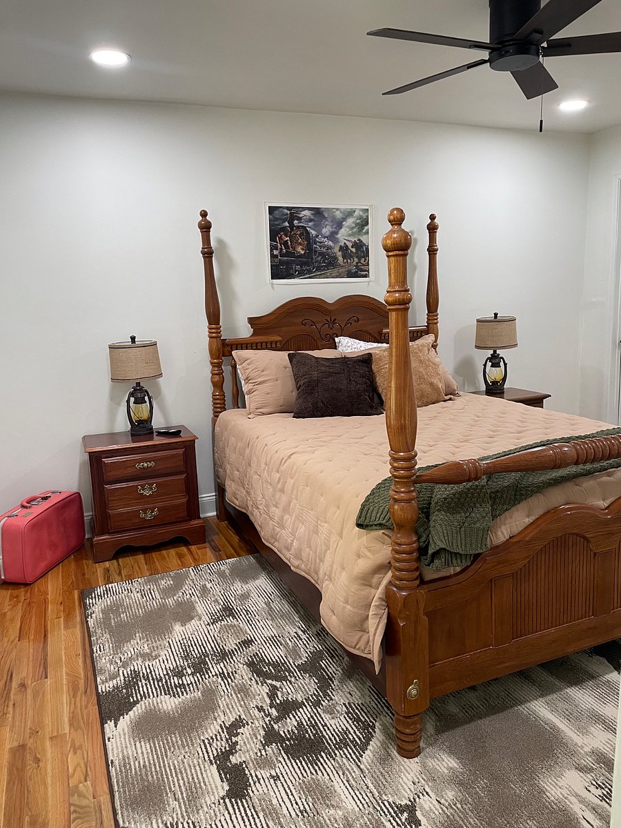 Queen Bed room downstairs with a private bathroom with a walk in shower.

