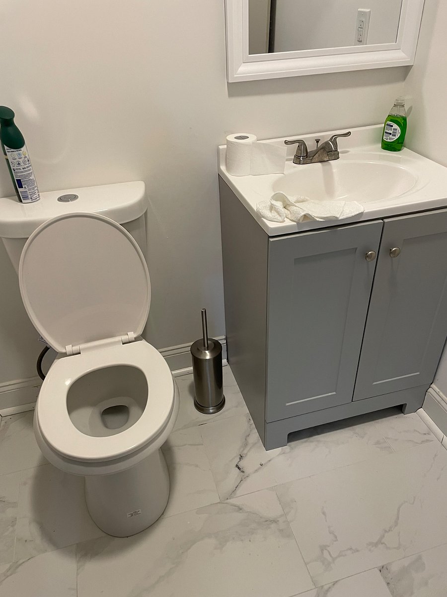 Downstairs half bath next to laundry room.