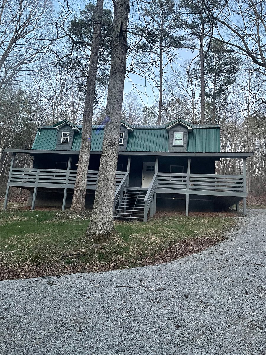 Beautiful Rossville Station with its large wrap around covered porch.  Located in a woodsy area. Designed for comfort, perfect for your short or long term stays.