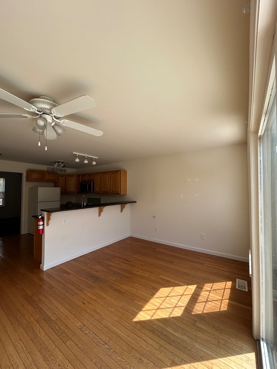 View from living area looking into full kitchen (New stainless steel refrigerator incoming)