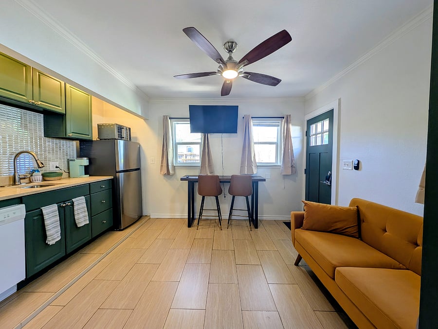 View of the living and kitchen areas from the bedroom