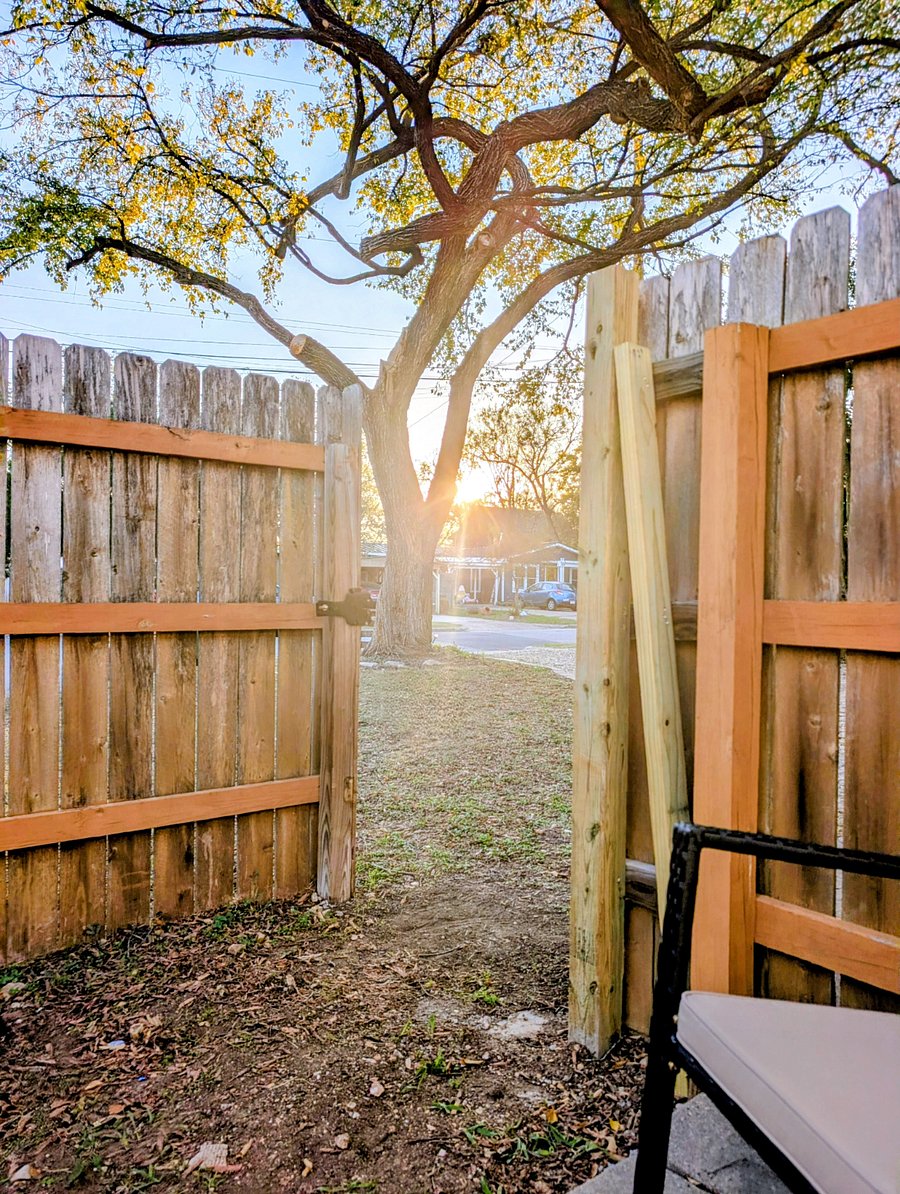 View from the patio out the gate into the front yard and street