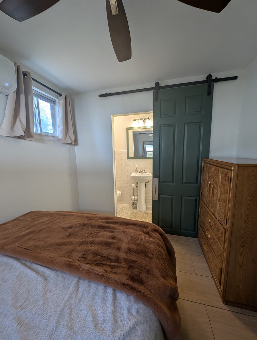 Bathroom is off of the bedroom and has a barn door for privacy