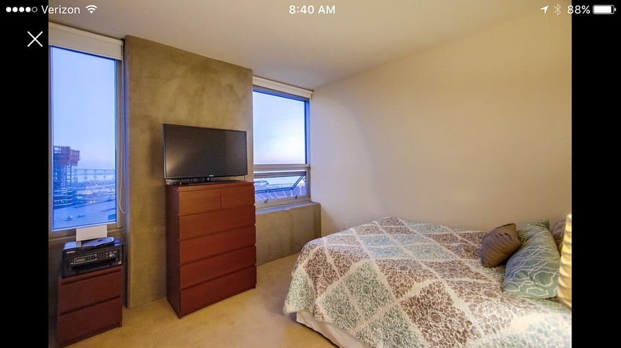 Guest bedroom with Full size bed and office desk and chair. The 2nd (guest) bedroom also has a closet for clothes to be hung up with hangers provided. 