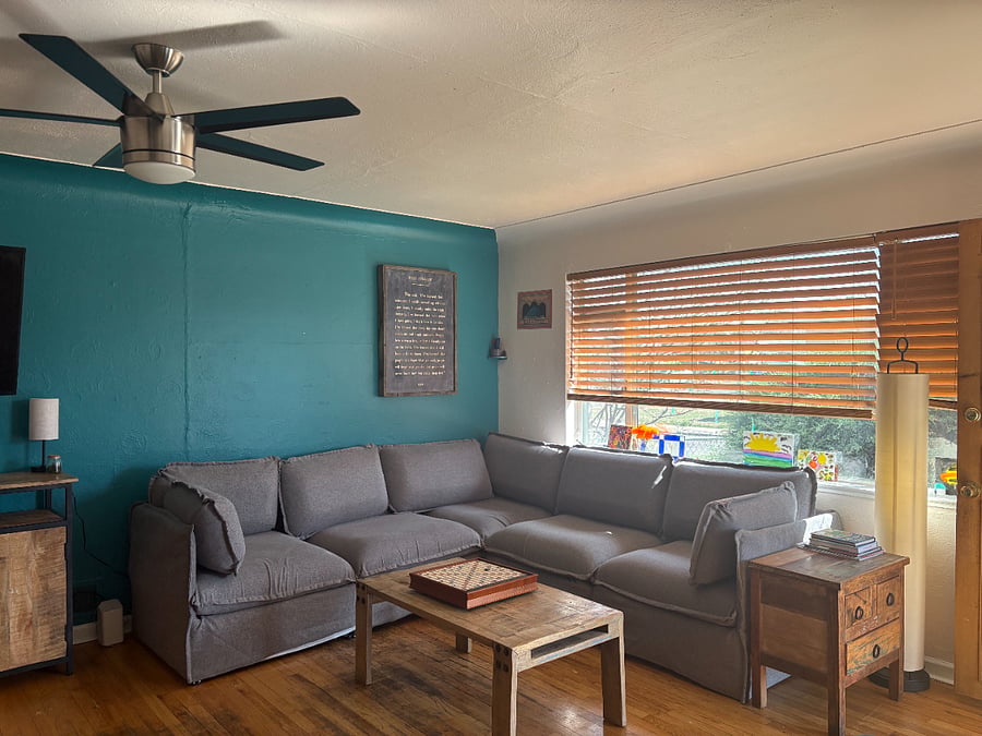 living room - new couch that can be adjusted/rearranged to your liking, wooden blinds can be adjusted, bookshelf, table and furniture by Rare Finds!