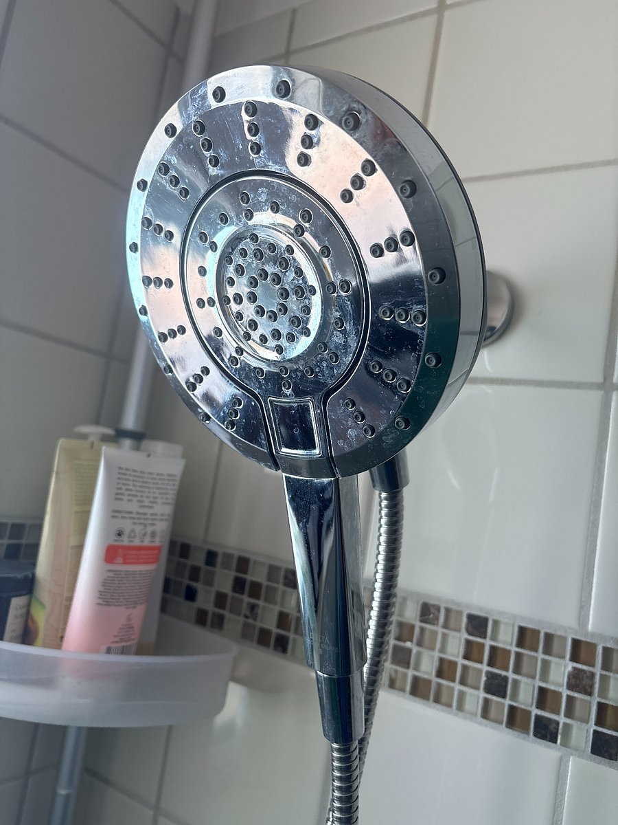 brand new shower head with multiple settings!