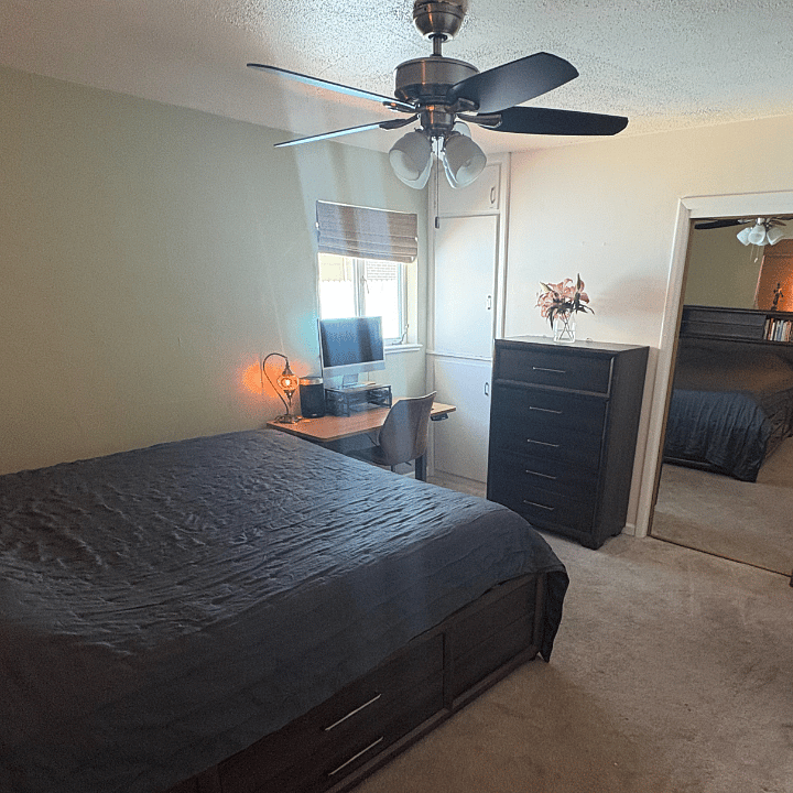 spacious primary bedroom - Cali King, ample storage, lots of light, black out curtains and a full closet with floor to ceiling mirror!