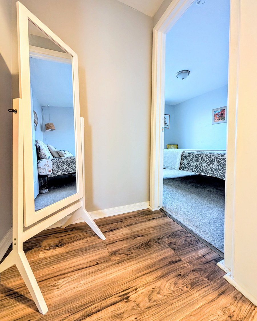 Upstairs hallway with full length mirror