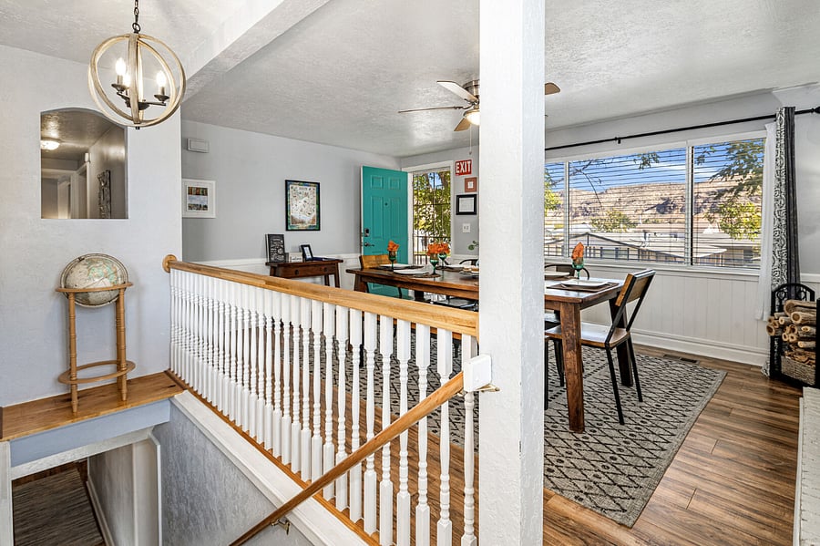 Dining room seats 8 comfortably with wood burning fireplace, mountain views, and bird songs.