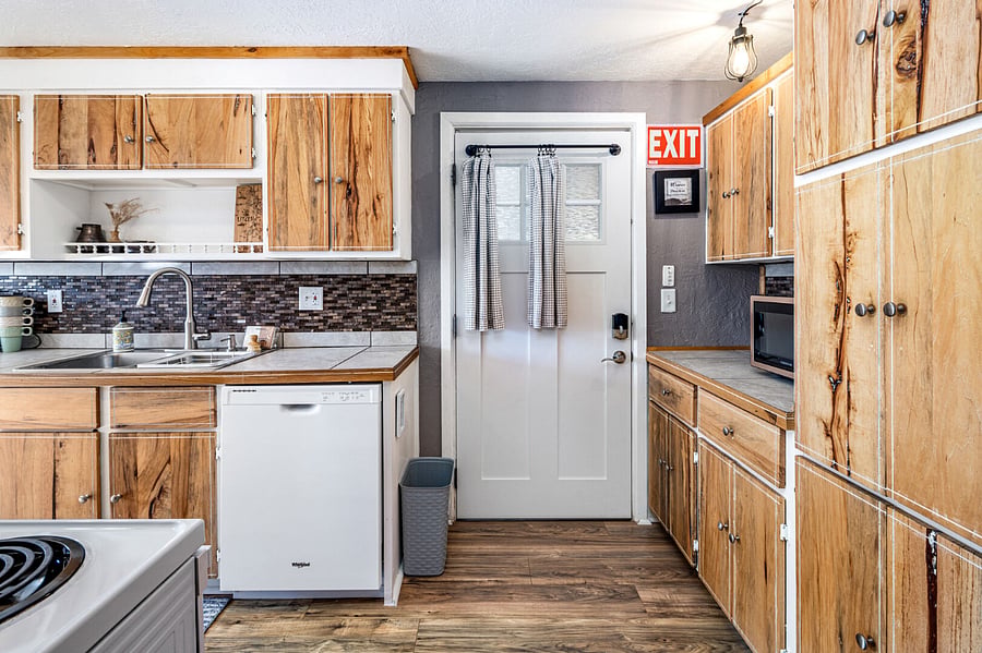 Well-stocked kitchen with everything you need to cook and serve delicious meals. Dishwasher, microwave, full size fridge, freezer, oven, stovetop. 