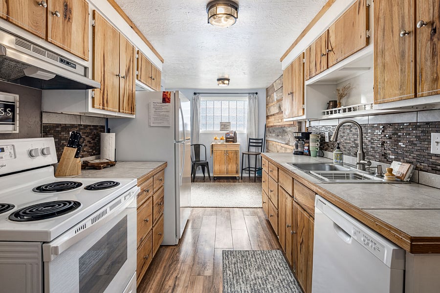 Well-stocked kitchen with everything you need to cook and serve delicious meals. Dishwasher, microwave, full size fridge, freezer, oven, stovetop. 