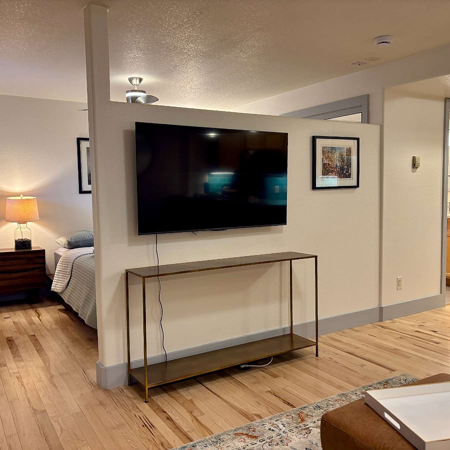 Smart TV with bedroom in background