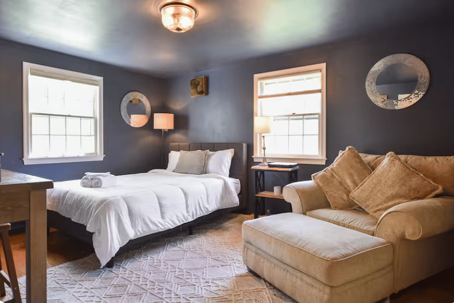 The guest bedroom is a bright and comfortable retreat, thoughtfully designed with a plush queen bed and soft, natural light. It offers a peaceful, relaxing space for rest, with easy access to a full bathroom just down the hall.