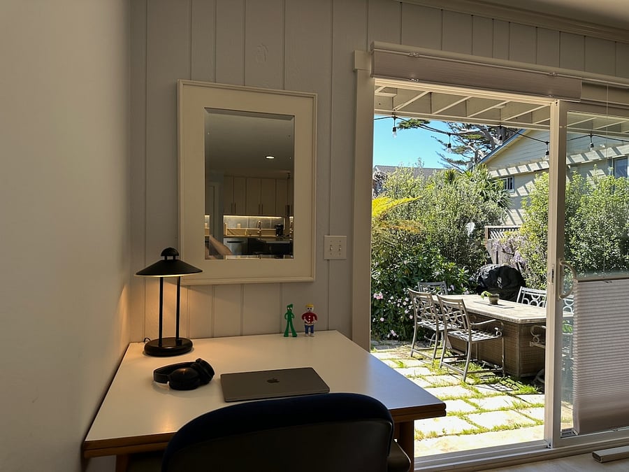 Work from home while listening to the waves, with a view of the sunny back yard.