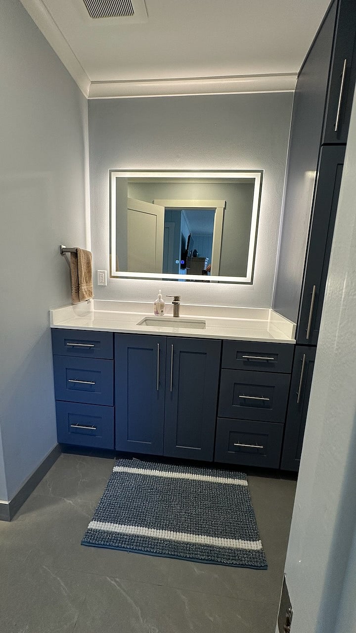 New bathroom with heated mirror, extra storage and full shower.