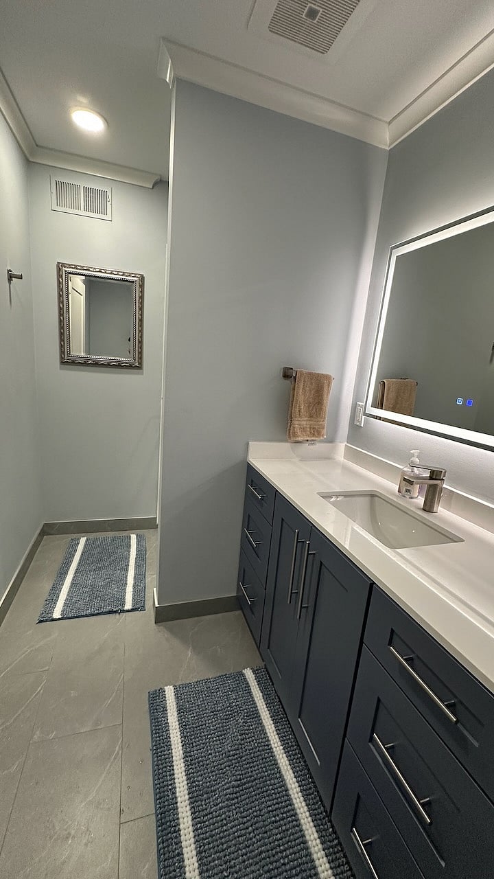 Heated mirror removes fog and lets you choose your light color temperature. Oversized cabinets with lots of storage space.
