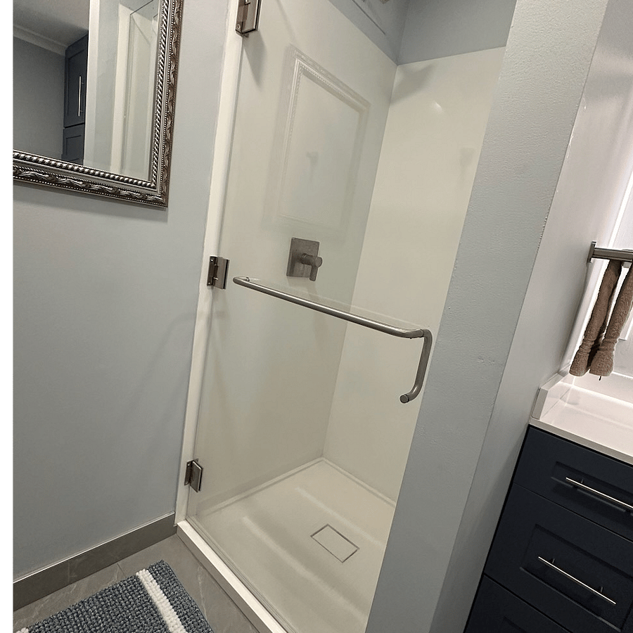 Walk in shower with rain head and seamless walls with no grout stays very clean.