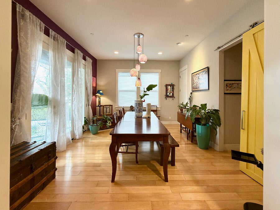 Dining room looks out on the front porch and lemon tree. Access the kitchen through the butlers pantry.