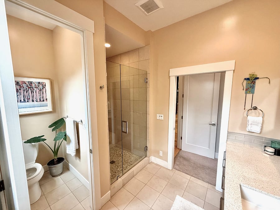 Ensuite bathroom in downstairs queen bedroom with private toilet closet