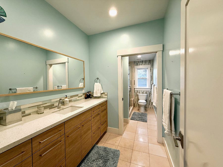 Upstairs hall bathroom, with toilet and shower separate from sink. 