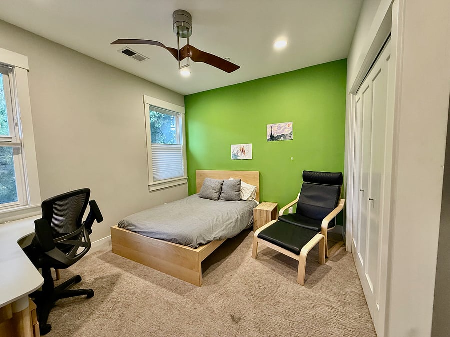 Second upstairs bedroom with queen bed and built in desk. 