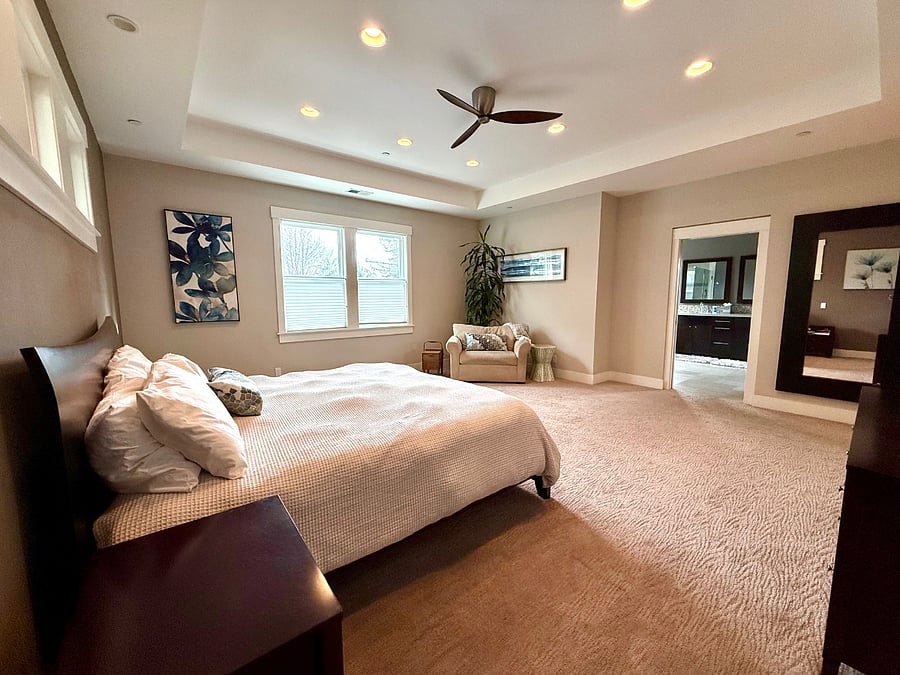 Upstairs primary suite with king size bed.