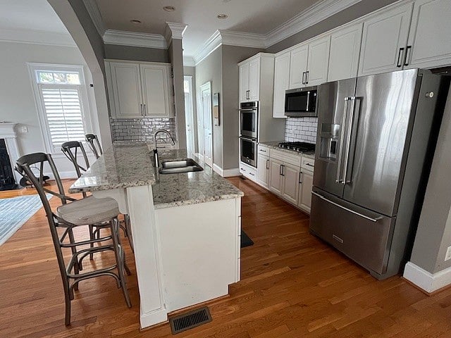 Kitchen and bar seating, hallway to outdoor patio