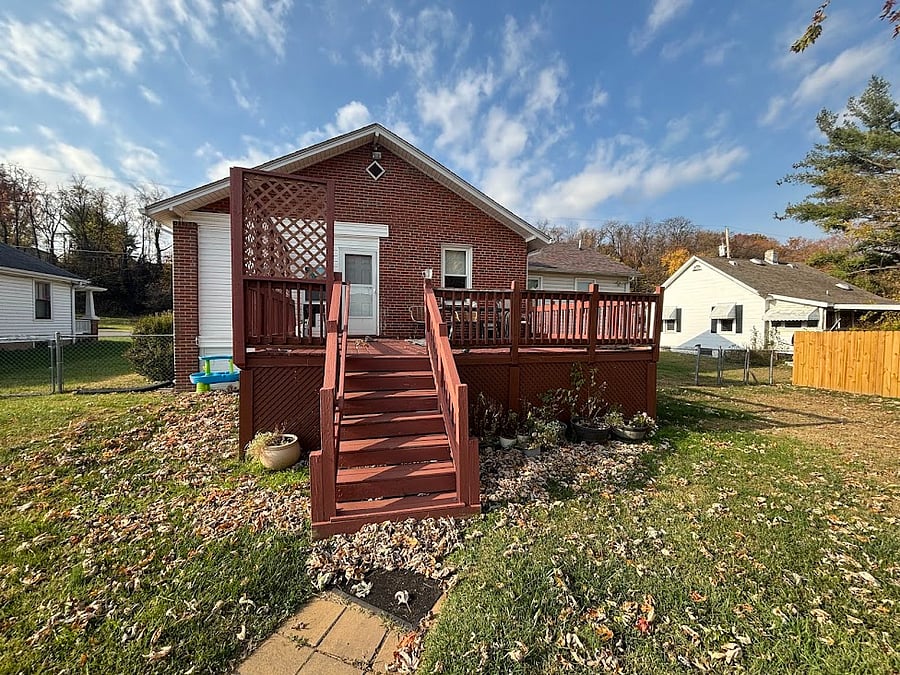 Back deck with oblong table & chairs. Lg umbrella for good shade, gas grill.