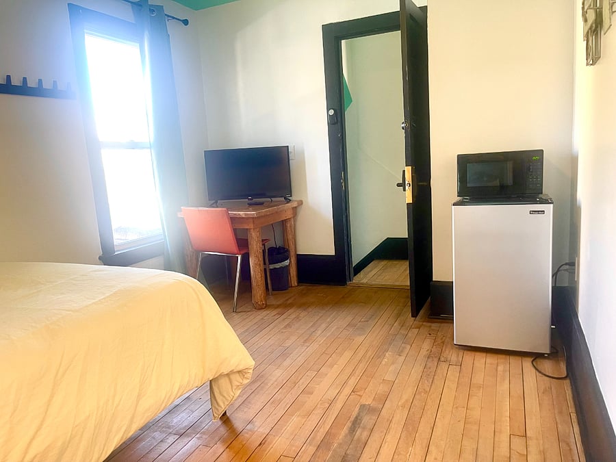 Bedroom 2 Full size bed,, TV, microwave, mini-fridge, and attached bathroom