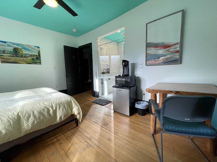 Bedroom 4: Queen size bed, closet, mini-fridge, single-serve coffee maker and attached bathroom