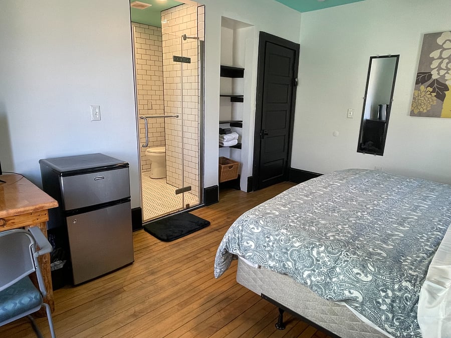 Bedroom 3: King size bed, TV, mini-fridge, microwave, and attached bathroom