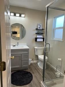 Bathroom completely overhauled new lighting with mold resistant fan, mirror, cabinets, toilet and shower.