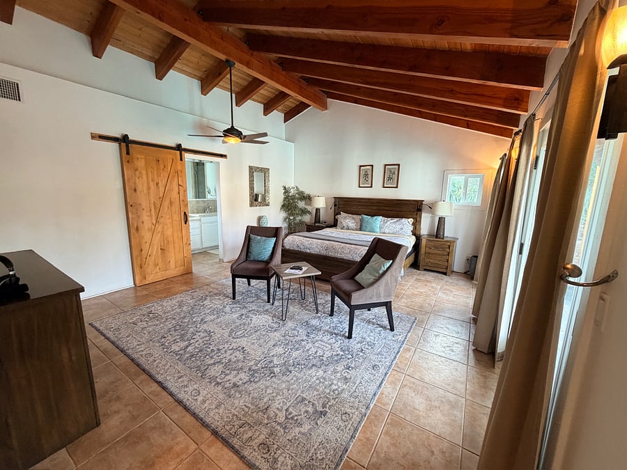 Spacious and serene with a king bed, vaulted ceilings, tv, and pool access.