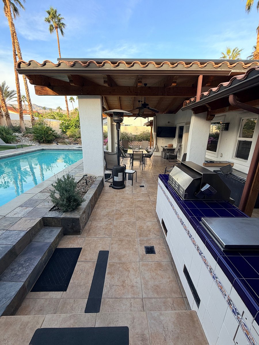 Fully equipped outdoor kitchen with built-in BBQ, perfect for al fresco dining and entertaining.
