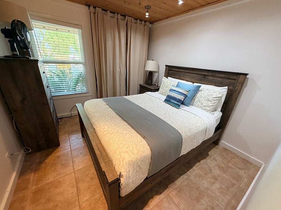 Comfortable rooms, each with a queen bed and easy access to a shared full bathroom.