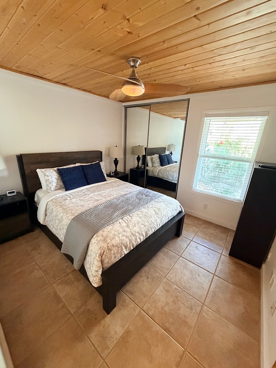 Comfortable rooms, each with a queen bed and easy access to a shared full bathroom.