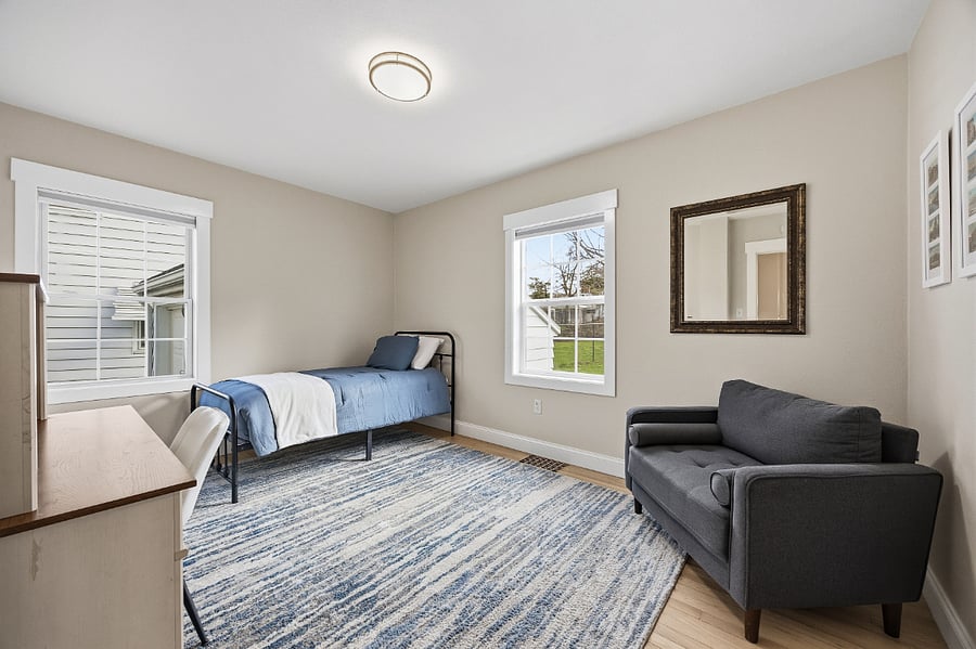 Twin bed and blackout curtains on the main level