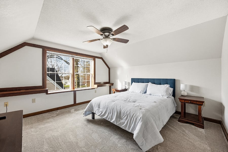 Cozy queen bed in the second story bedroom
