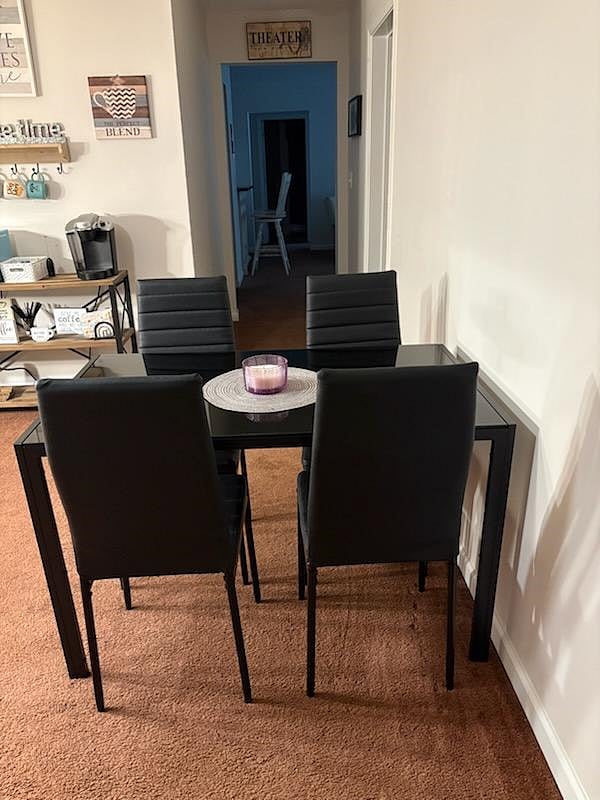 Another view of kitchen table with 4 chairs.
